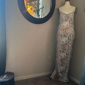 Elegant Lace Gown with Feather Details